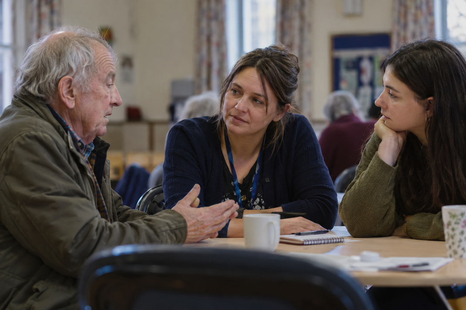 Thoughtful conversation in a community hall-2